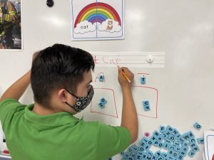 Special education student at IDEA Southeast Academy engages in a writing lesson | National Special Education Day | IDEA Public Schools