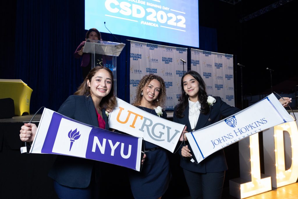 IDEA Seniors at College Signing Day 2022 revealing their college selections (L to R: NYU, UTRGV, Johns Hopkins University