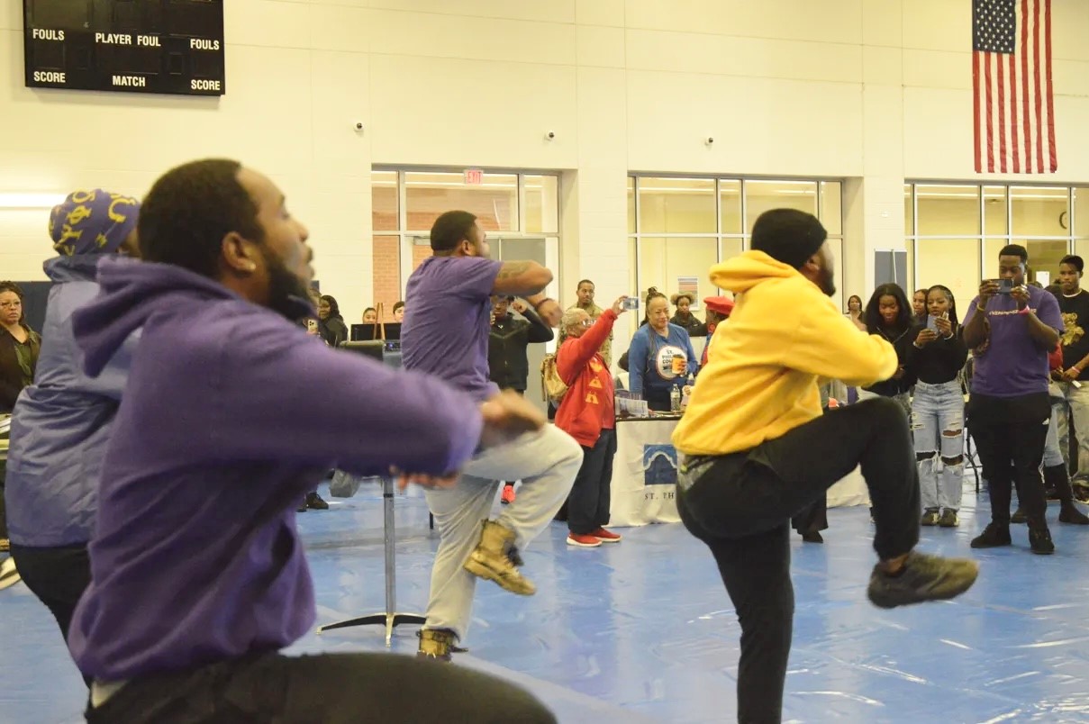 Psi Alpha Chapter of Omega Psi Phi fraternity members step for crowds at the Annual South Texas HBCU College Fair