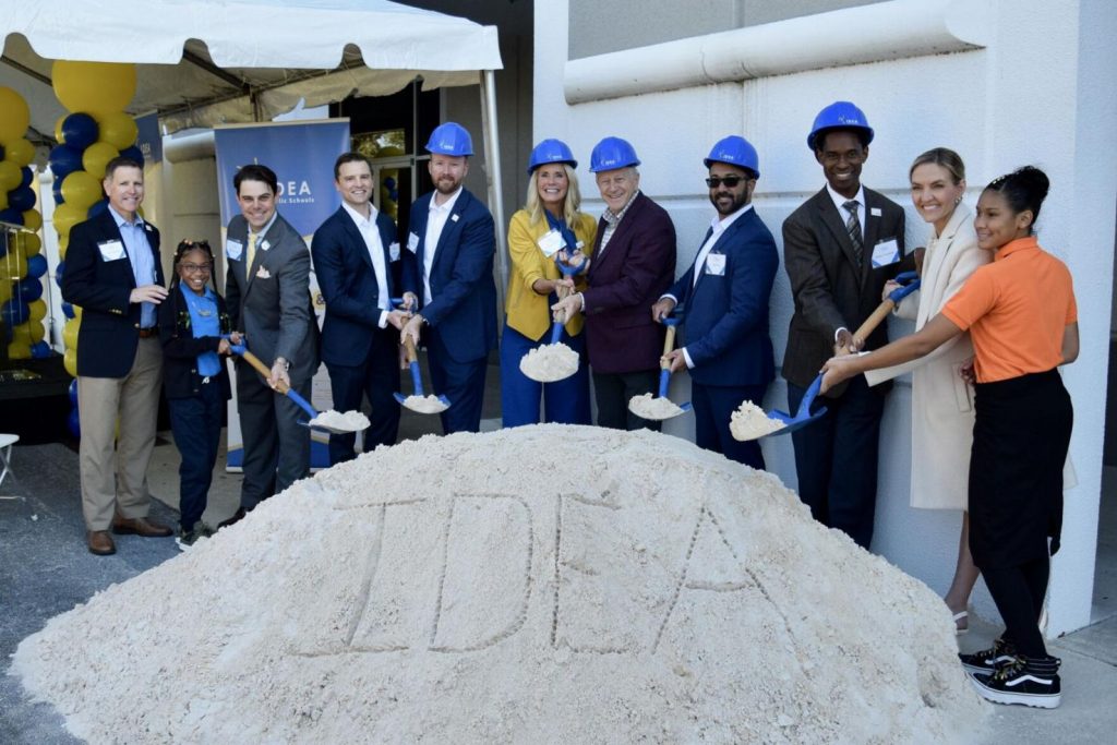 Group of people with shovels and hard hats